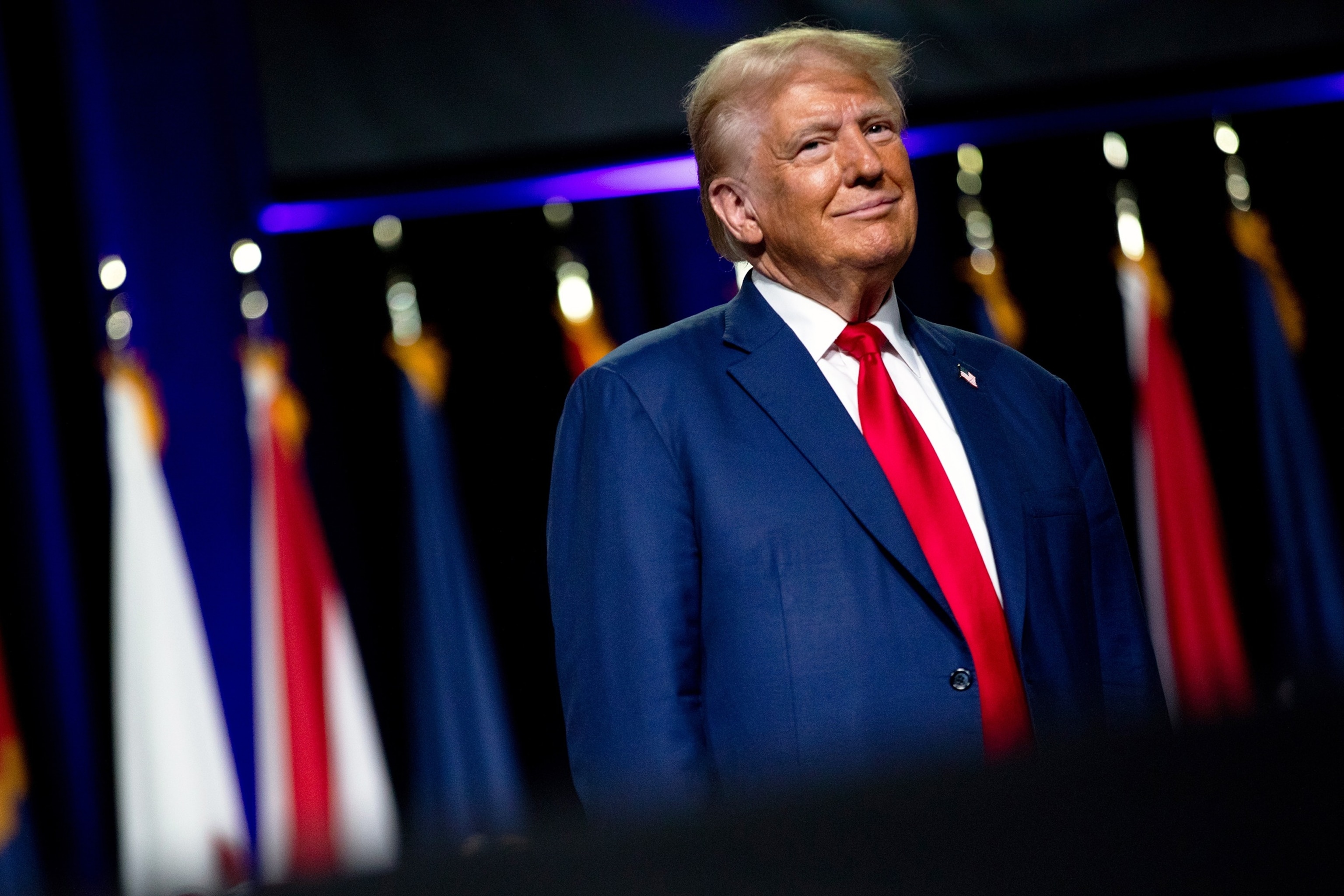 PHOTO: Republican presidential nominee, former President Donald Trump smiles at the crowd during the National Guard Association of the United States' 146th General Conference & Exhibition, on Aug. 26, 2024, in Detroit.